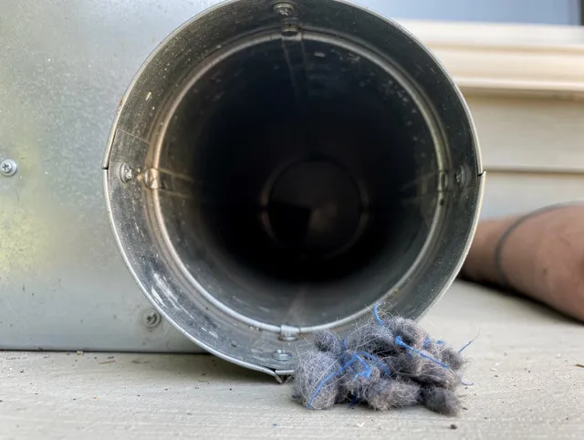 St. Cloud Dryer Vent Cleaning technician using specialized equipment to clear severe dryer vent blockage in St. Cloud